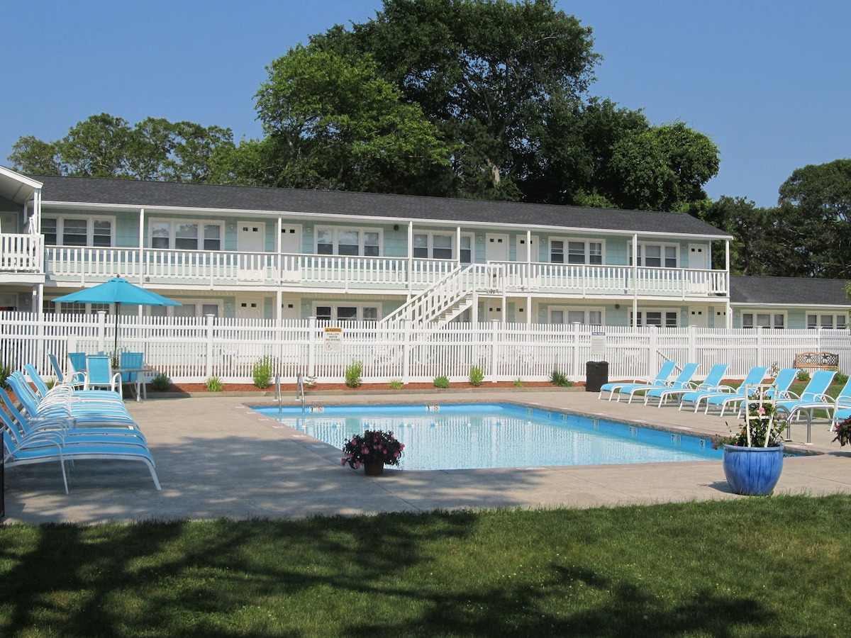 Daytime pool at The Escape Inn