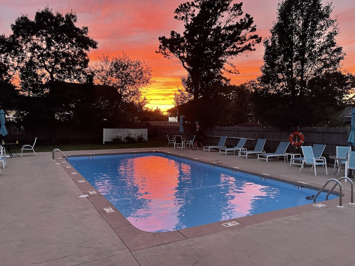 The Escape Inn pool at golden hour